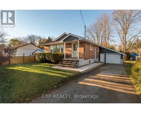 A house with a driveway in front of it is for sale.