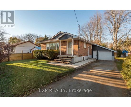 A house with a driveway in front of it is for sale.