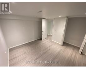 A room with EXP REALTY, Brokerage written on the floor.