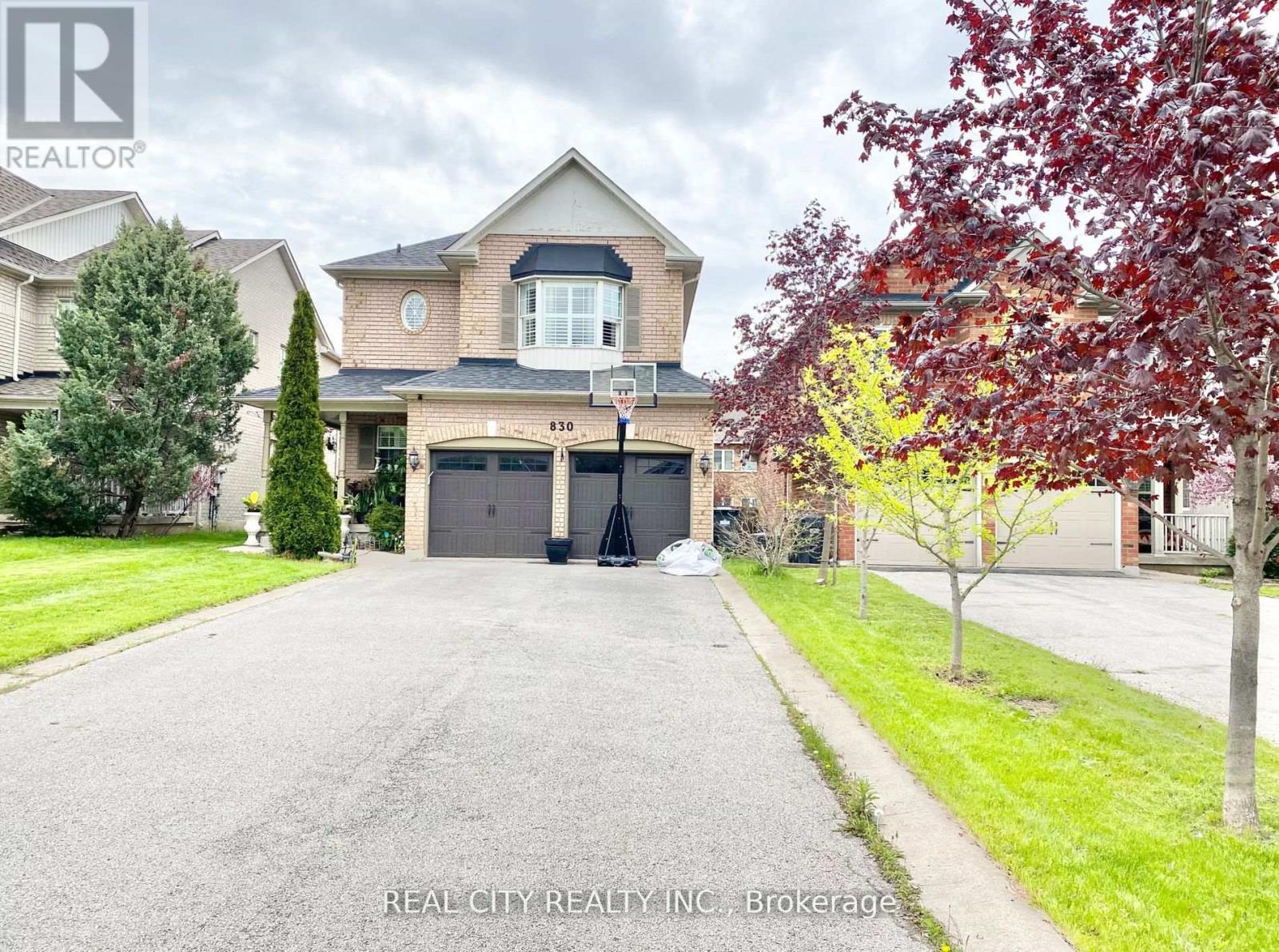 A house with a driveway in front of it.