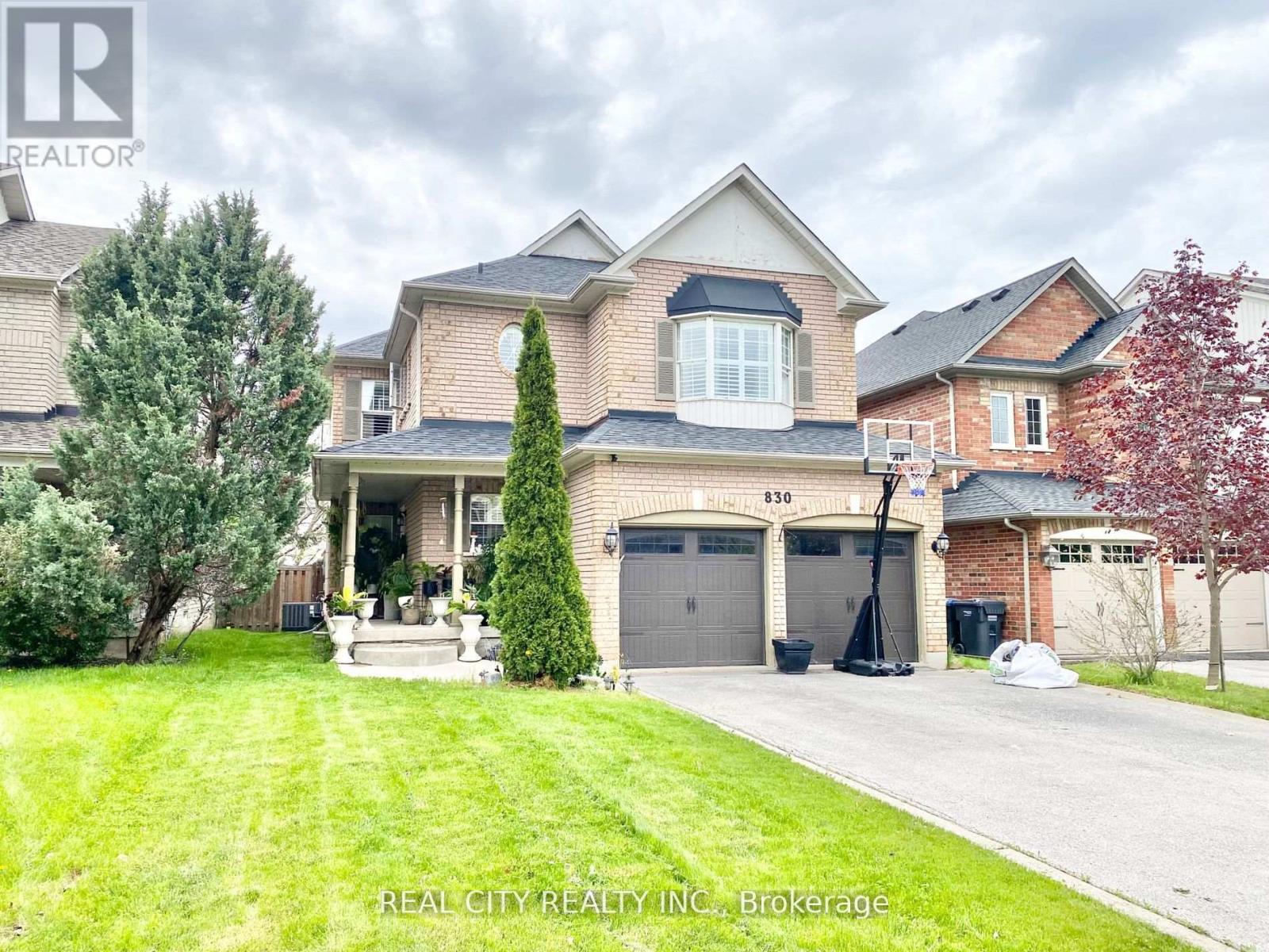 A large house with a garage is for sale.
