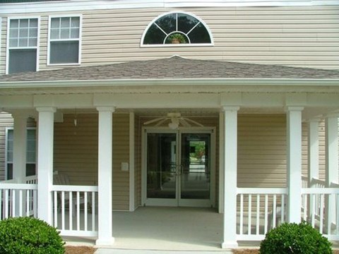 A house with a porch and a window.