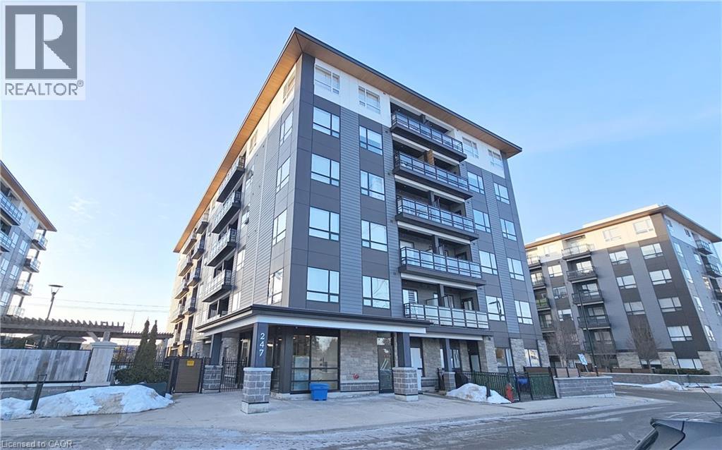 A modern apartment building with a clear sky in the background.
