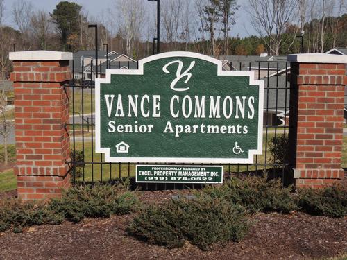 A sign for Vance Commons Senior Apartments is shown.