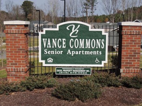 A sign for Vance Commons Senior Apartments is shown.