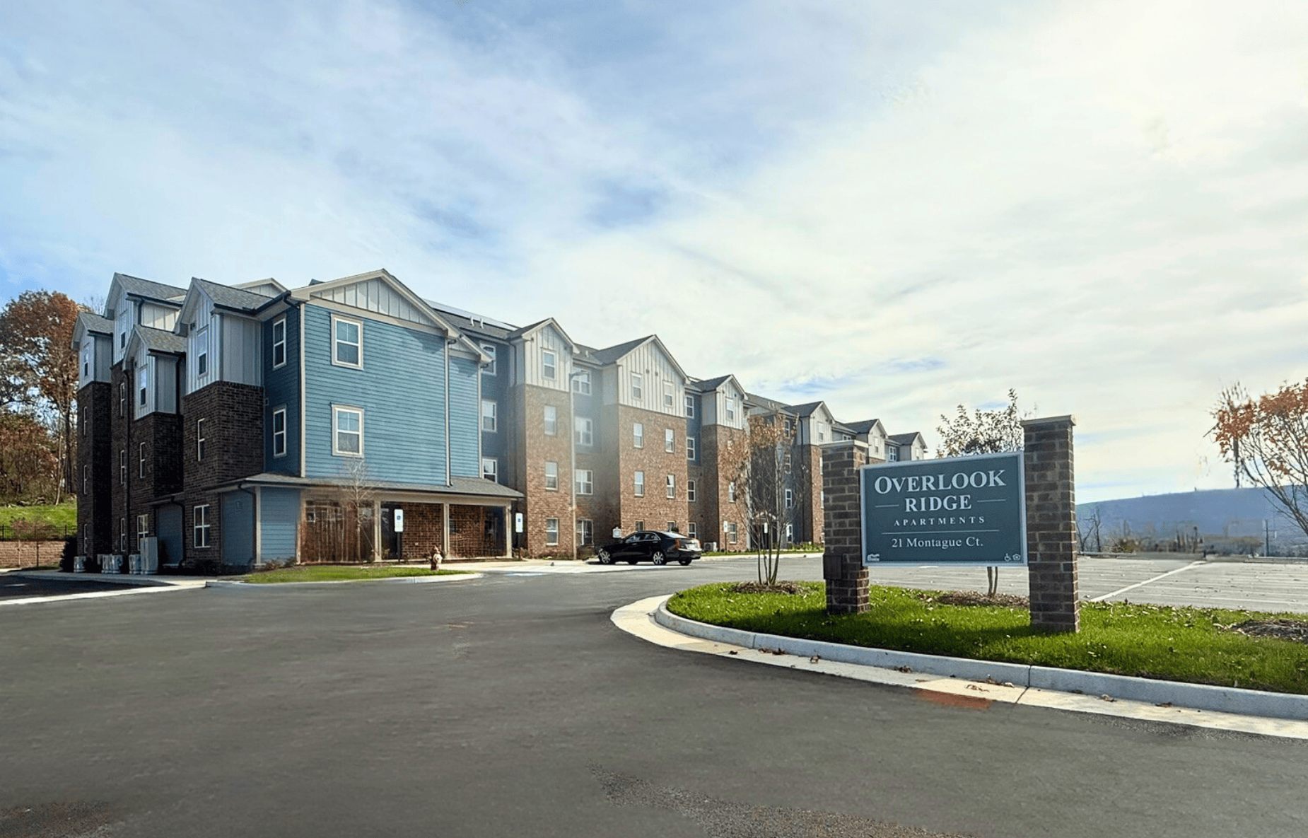 A row of houses with a sign that says Overlook Ridge.