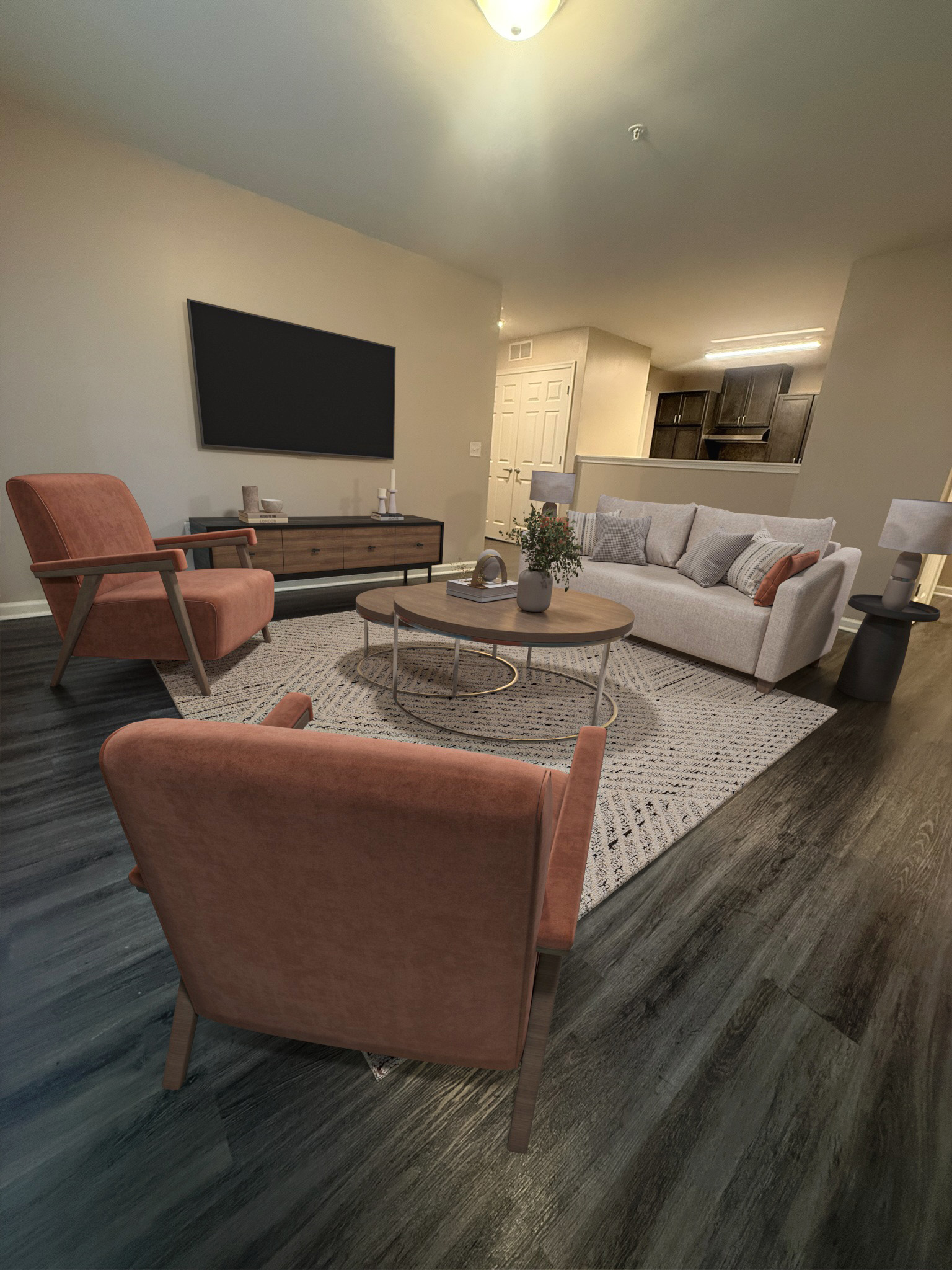 A living room with a couch, chair, and television.