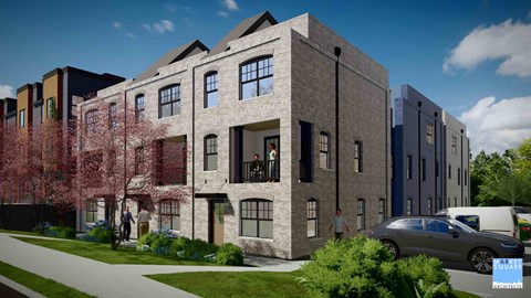 A modern apartment complex with a mix of brick and panel buildings.