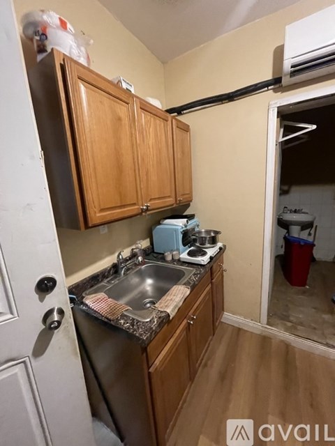 A small kitchen with a sink and a stove.