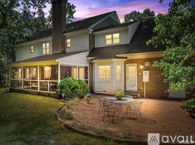 A house with a patio and a table set for four.