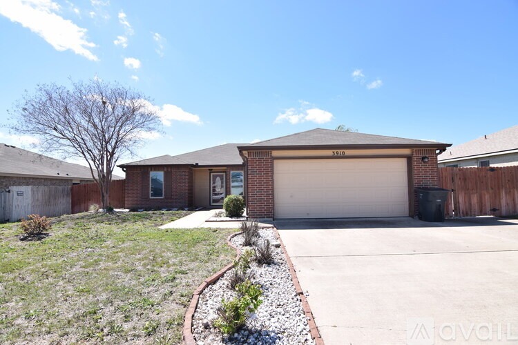 A house with a brown garage door and a driveway.