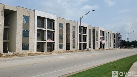A row of new apartment buildings are under construction.