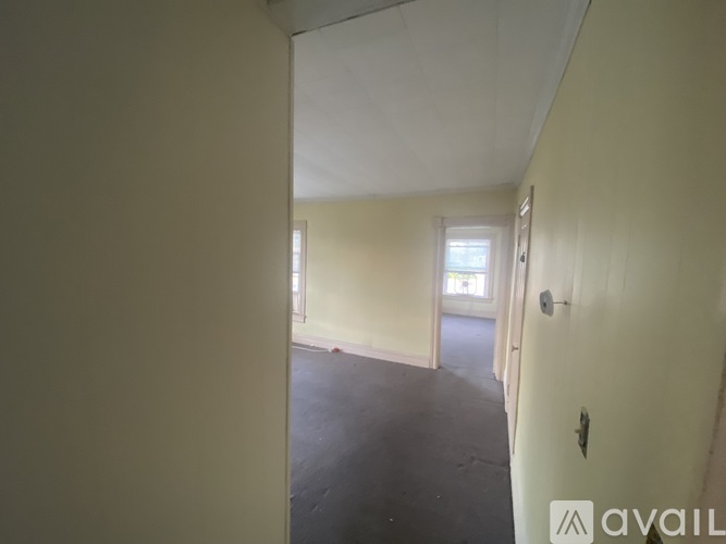 A room with a door and a window.