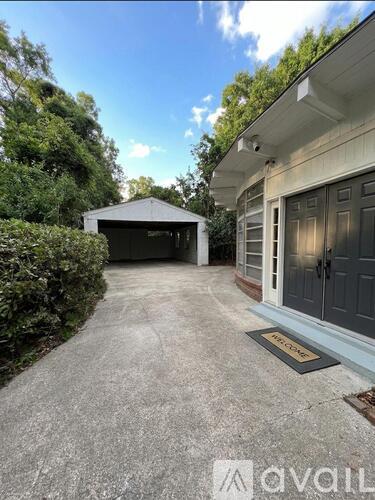 A house with a driveway and a garage door.
