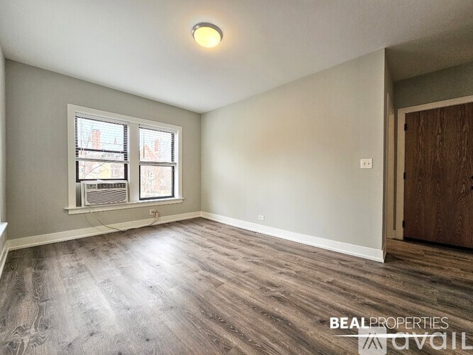 A room with a window and a door is shown.