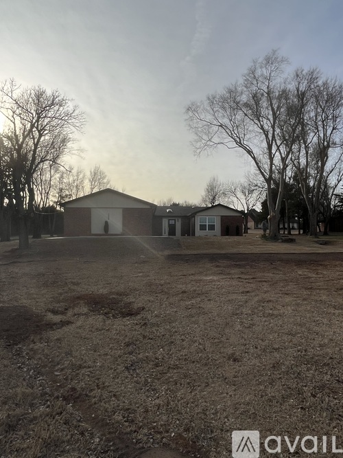 A house with a yard in front of it.