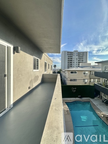 A pool is in the middle of a patio.