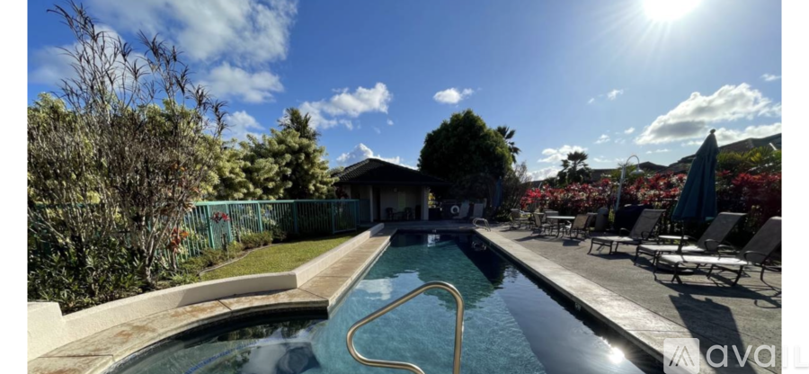A pool with a sunny sky in the background.