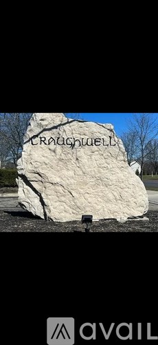 A large stone with the name "Croughwell" carved into it.
