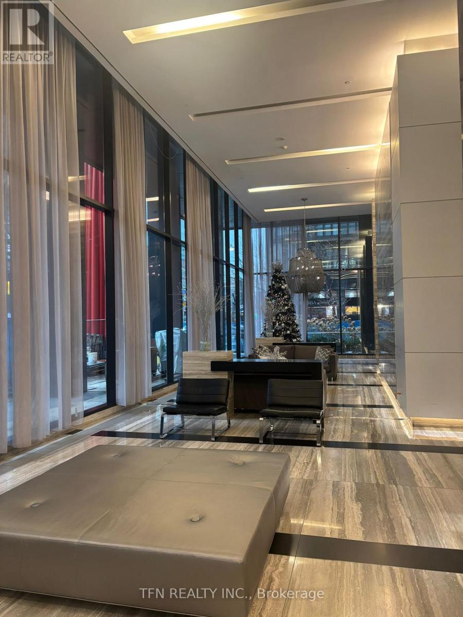 A modern office lobby with a Christmas tree in the background.