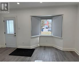 A room with a window and a door.