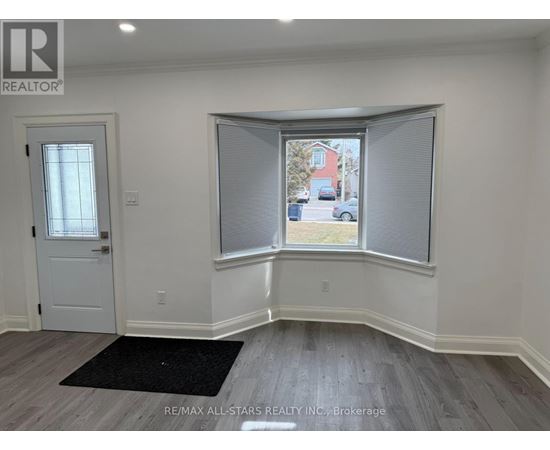 A room with a window and a door.