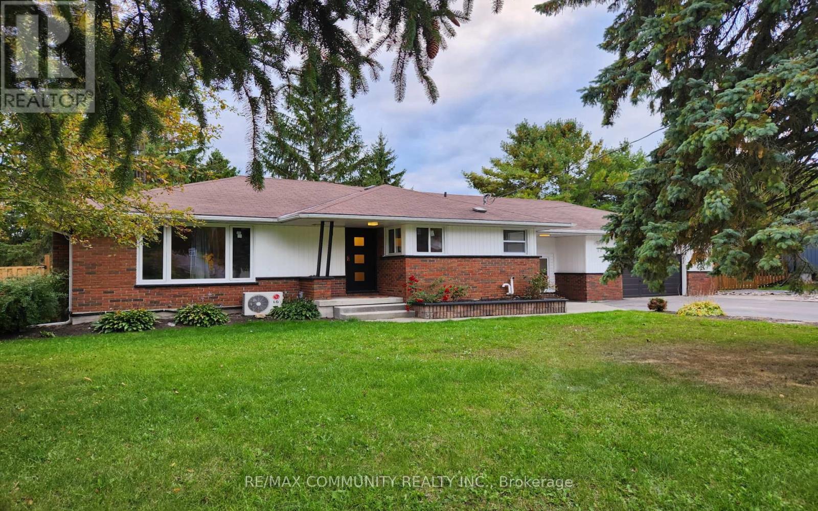 A house with a lawn in front of it.