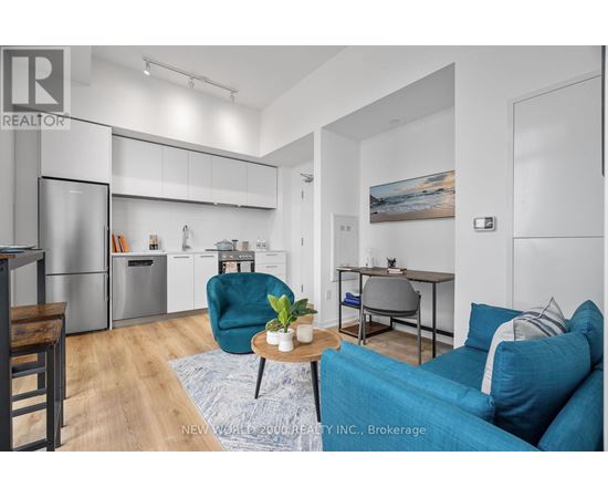 A modern living room with a blue couch and a coffee table.