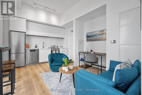 A modern living room with a blue couch and a coffee table.