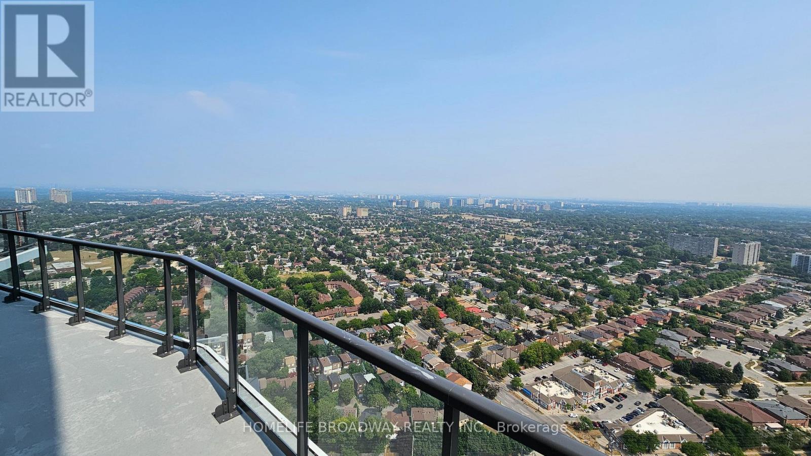 A view from a high-rise building looking down at a cityscape.