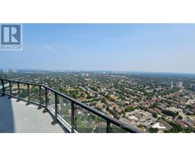A view from a high-rise building looking down at a cityscape.