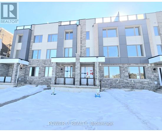 A building with the text "POWER 7 REALTY, Brokerage" in front of it.