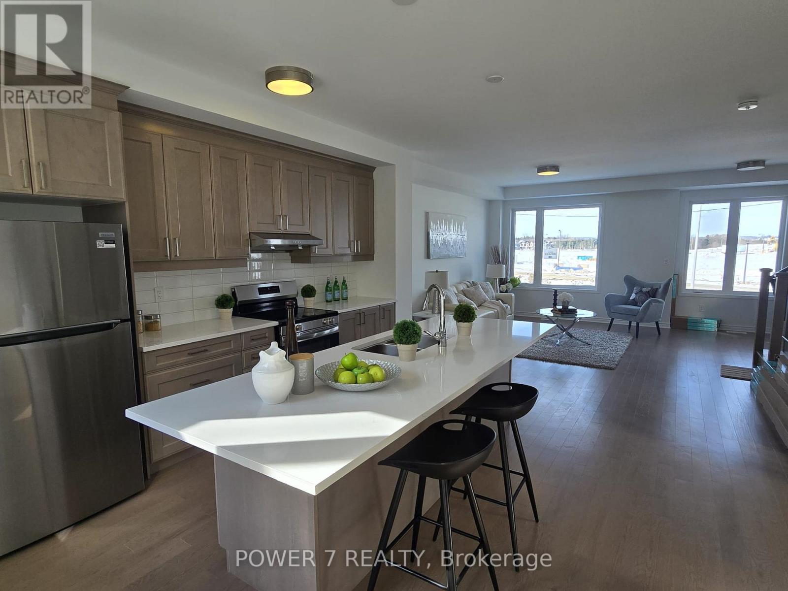A modern kitchen with wooden cabinets and a large island.