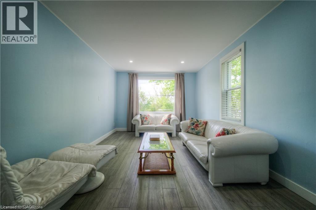 A living room with a white couch and a coffee table.