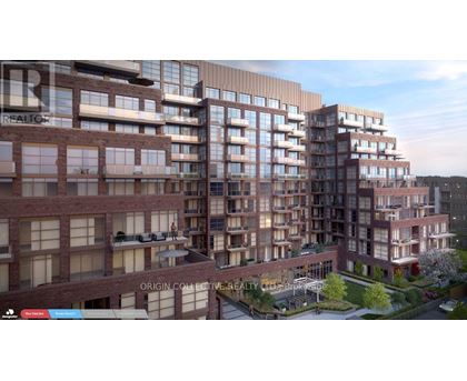 A modern apartment complex with multiple buildings and balconies.