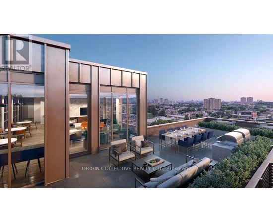 A modern building with a glass facade and a balcony with outdoor furniture.