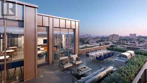 A modern building with a glass facade and a balcony with outdoor furniture.