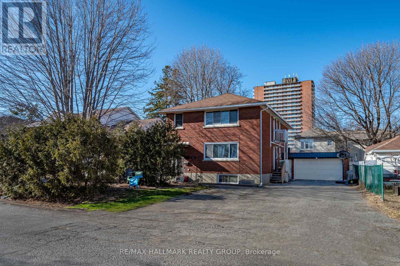 A house with a garage is for sale.