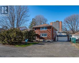 A house with a garage is for sale.