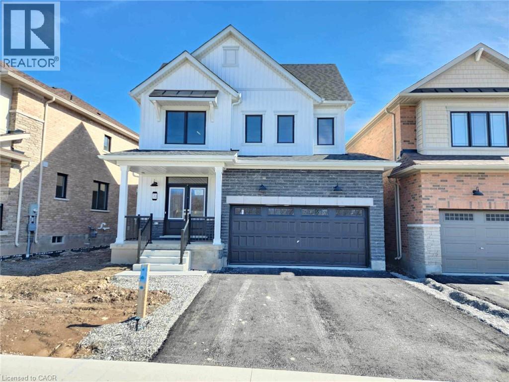 A two-story house with a garage is for sale.