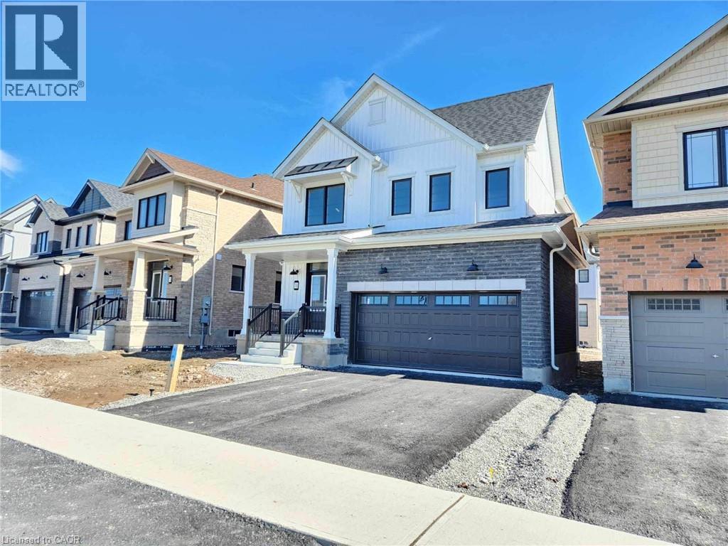 A row of houses with a realtor logo in the corner.