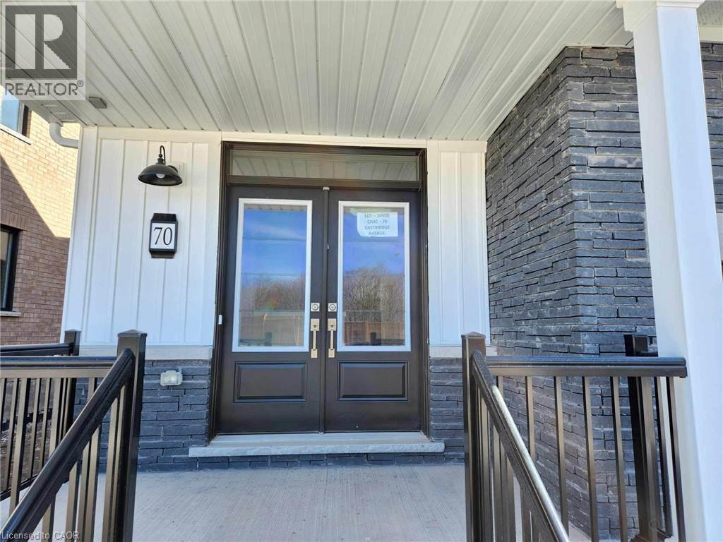 The front door of a house with a number 70 on the wall above it.