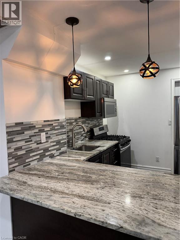 A kitchen with a granite countertop and a modern design.