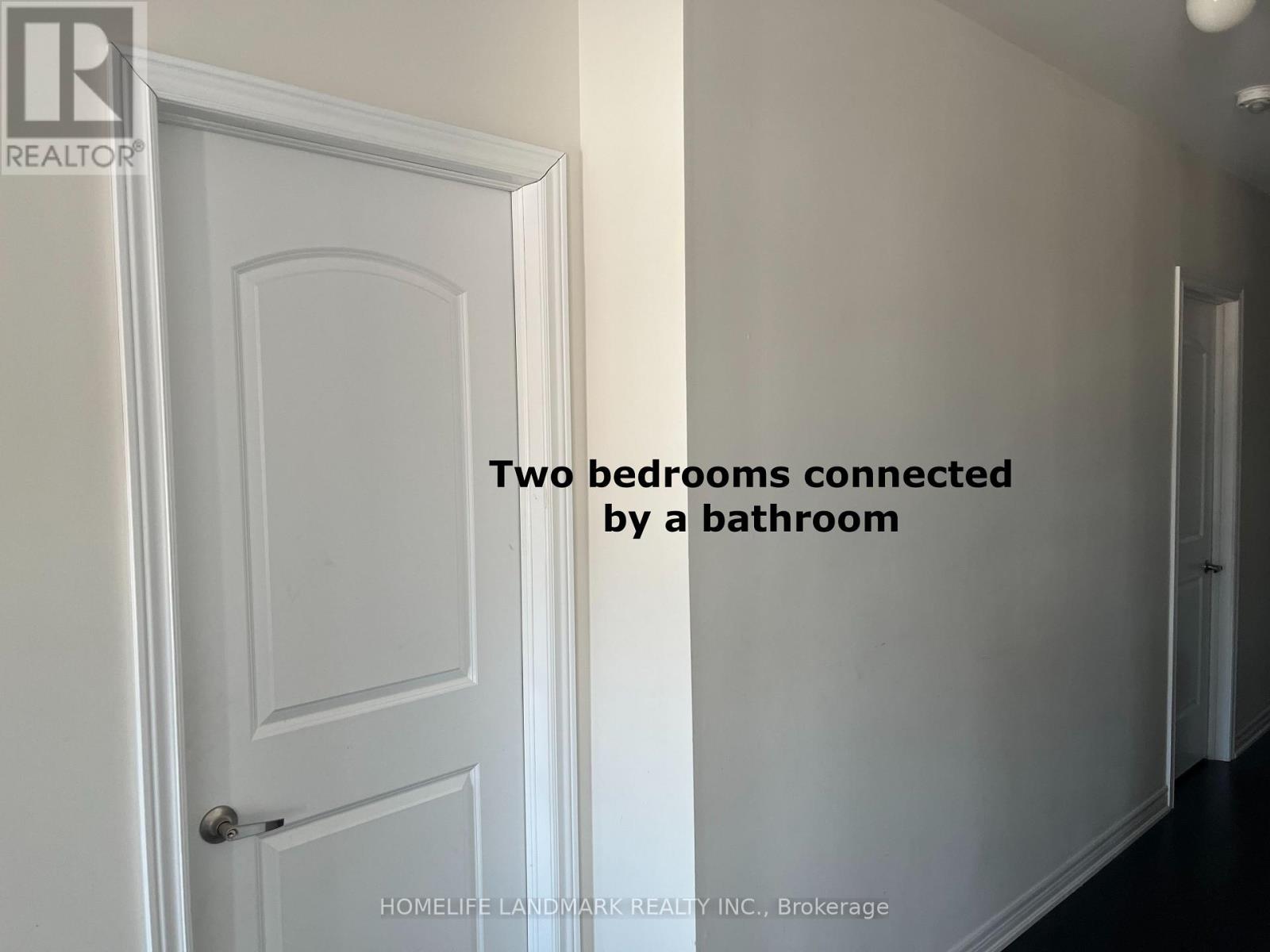 Two bedrooms connected by a bathroom.