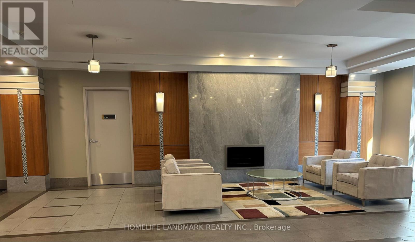 A modern living room with a fireplace and a glass table.