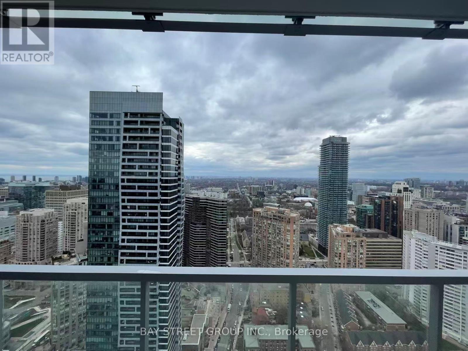A cityscape with a Bay Street Group Inc. sign in the foreground.