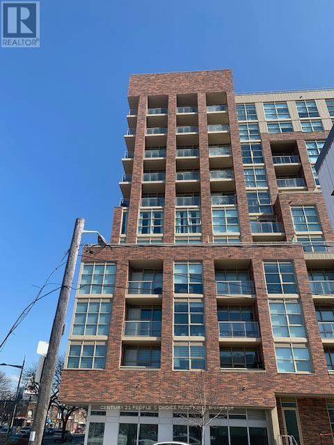 A tall building with a sign that says "REALTOR" on it.