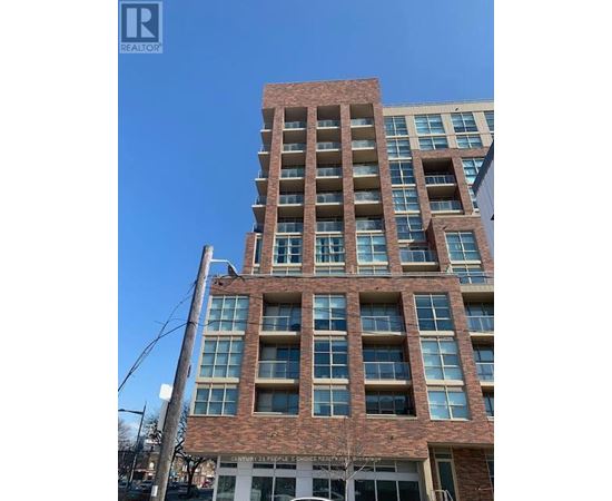 A tall building with a sign that says "REALTOR" on it.