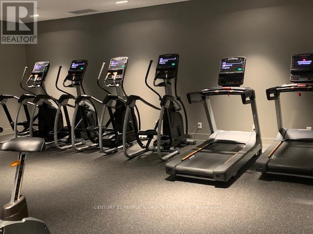 A gym with treadmills and exercise bikes.