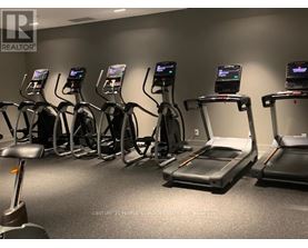 A gym with treadmills and exercise bikes.